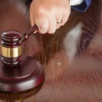 judge-slams-his-gavel-and-american-flag-table-refl-2024-09-11-18-15-38-utc.webp